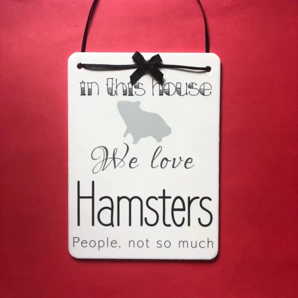 In this house we love hamsters sign